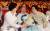문재인 대통령 부인 김정숙 여사가 15일 오전 세종문화회관에서 열린 제72주년 광복절 경축식에서 일본군 위안부 피해자인 길원옥(가운데)ㆍ이용수(오른쪽) 할머니의 손을 잡고 얘기를 나누고 있다. 청와대사진기자단