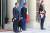 28일(현지시간) 프랑스 파리 엘리제궁 앞에서 에마뉘엘 마크롱 대통령 옆에 서 있는 유기견 '퍼스트 도그' 네모. [AFP=연합뉴스]