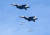 공군 F-15K 전투기들이29일 오전 강원도 필승사격장에서 실시된 공격 편대군 실무장 폭격 훈련에서 무게 1톤의 MK-84 폭탄을가상의 북한 지휘부 지점에 투하하고 있다. [사진 공군]