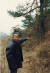 주남마을 주민 박학수씨가 5.18 당시 청년 2명이 살해, 매장된 마을 뒷산의 소나무 주변을 가리키고 있다. 김상선 기자