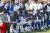 24일 열린 경기에 앞서 국민의례 중 무릎을 꿇고 앉은 NFL 버팔로 빌스의 선수들.[AP=연합뉴스]