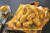 ‘써프라이드 치킨’은 올리브유에 튀겨낸 후라이드 치킨에 자포네 소스로 맛을 내고 황금빛 플레이크를 골고루 뿌린 치킨 메뉴이다. [사진·BBQ]