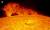 홍염이 피어오르는 태양 표면 모습. 지구와 홍염 크기을 비교하기 위해 왼쪽 상단에 지구를 합성한 사진이다. [사진 별새꽃돌 과학관]