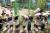 지난 9월 12일 부산 기장군 정관읍 가동유치원에서 열린 지진대피훈련에서 어린이들이 책가방을 머리에 이고 운동장으로 대피하고 있다. [연합뉴스]