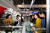 제20차 평양 봄철국제상품전람회장을 둘러보며 상품을 구경하는 평양시민들. [사진 조선의 오늘]