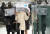 18일 오전 광화문에서 시민들이 신문지로 눈을 피하며 출근하고 있다. [연합뉴스]