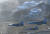 FA-50편대가 강릉 아이스아레나(위쪽좌측), 스피드스케이트장(위쪽우측) 상공을 비행하고 있다. [사진 공군]