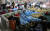  제주공항 항공편 이용객들이 12일 새벽 제주도와 한국공항공사 제주지역본부가 제공한 매트리스와 담요를 활용해 새우잠을 자고 있다. [연합뉴스]