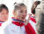 북한 피겨 염대옥이 8일 오전 강원도 강릉 평창동계올림픽 선수촌에서 열린 선수단 입촌식에서 인공기가 게양되며 국가가 나오자 울먹이고 있다. [뉴스1]