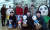 네이버웹툰 사무실 입구의 웹툰 캐릭터 앞에 김준구 대표(가운데 빨간 옷)와 직원들이 모였다. 최승식 기자