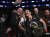 크리스 사이보그(오른쪽)가 4일 열린 UFC 222 여자 페더급 타이틀전에서 이긴 뒤 팬들과 사진을 찍고 있다. [라스베이거스 AP=연합뉴스]