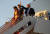 도널드 트럼프 대통령과 부인 멜라니아 여사 아들 배런이 지난달 23일 플로리다 팜비치 공군 공항에 도착해 트랙을 내려오고 있다. [AP=연합뉴스]