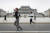 참가 선수들이 김일성 광장을 지나고 있다. [AFP=연합뉴스]