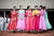 도우미로 보이는 여성들이 한복을 입고 김일성 경기장에서 출발을 기다리고 있다. [AFP=연합뉴스]