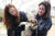 김효진 동물보호단체 케어 홍보대사가 10일 오후 경기도 남양주시의 한 식용견 농장에서 관계자와 함께 도살을 앞둔 개들을 구조하고 있다. [뉴스1]