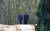 기념식수를 마친 뒤 문재인 대통령과 북한 김정은 국무위원장이 27일 오후 판문점 남측 군사분계선 인근에서 산책을 하고 있다. [연합뉴스]