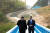 문재인 대통령(오른쪽)과 김정은 국무위원장이 지난달 27일 열린 남북정상회담에서 공동 식수를 마친 후 군사분계선 표식물이 있는 ‘도보다리’까지 산책을 하며 담소를 나누고 있다. [청와대사진기자단]