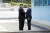 27일 오전 판문점에서 문재인 대통령과 김정은 국무위원장이 손을 잡고 있다. [청와대사진기자단] 