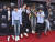 방탄소년단 멤버들이 20일(현지시간) 미국 라스베이거스 MGM 그랜드 아레나에서 열린 2018 빌보드 뮤직 어워드에 참석하며 포토월 앞에서 점프를 하며 포즈를 취하고 있다. [AP=연합뉴스]