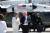 도널드 트럼프 미국 대통령이 9일(현지시간) 캐나다 공군기지에서 주 캐나다 대사인 켈리 나이트 크래프트와 대화하며 에어포스 원으로 향하고 있다. [AFP=연합뉴스]