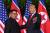 12일 열린 북미정상회담에서 북한에서 &#39;최고존엄&#39;으로 통하는 김정은 위원장의 어깨를 두드리며 취재진을 향해 사진포즈를 유도하는 트럼프 대통령.[AP=연합뉴스]