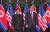 도널드 트럼프 미국 대통령과 김정은 북한 국무위원장이 12일 오전 북미 정상회담이 열린 싱가포르 센토사섬 카펠라호텔에서 기념촬영을 하고 있다. [싱가포르통신정보부 제공=뉴스1]
