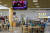 11일(현지시간) 미국 캘리포니아 주 로스앤젤레스 코리아 타운 인근 쇼핑 몰 푸드코트에서 시민들이 정상회담 방송을 보고 있다. [로이터=연합뉴스]