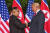 역사적 첫 북미정상회담이 열린 12일 오전 회담장인 카펠라 호텔에 북한 김정은 위원장과 미국 트럼프 대통령이 회담을 위해 만나고 악수를 나누고 있다. [사진 싱가포르 통신정보부 제공]