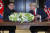 도널드 트럼프 미국 대통령과 김정은 북한 국무위원장이 12일 싱가포르 카펠라 호텔에서 합의문에 서명한 후 미소짓고 있다. [AP=연합뉴스]