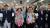윤일규 더불어민주당 천안병 국회의원 당선인(오른쪽 둘째)이 13일 충남 천안 선거사무실에서 꽃목걸이를 목에 건 채 두 손을 들어보이고 있다. [뉴스1]