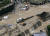  7일 일본 히로시마현 아키지역이 산사태로 도로가 흘탕물과 떠내려온 차량으로 뒤엉켜있다. [AP=연합뉴스]