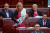 2017년 6월 22일 호주 캔버라 의회 의사당에서 라리사 워터스 호주 상원 의원이 아이에게 모유 수유를 하며 학교 기금 법안에 대해 연설하고 있다. [로이터=연합뉴스]