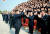 김정은 북한 국무위원장이 지난 2015년 대사회의에 참석한 관계자들과 기념촬영을 한 뒤 손을 흔들고 있다.[사진=조선중앙TV 캡처]