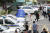 23일 오전 정의당 노회찬 원내대표가 투신 사망한 것으로 알려진 서울 중구 한 아파트에서 경찰 과학수사대원들이 조사하고 있다. [뉴스1]