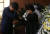 조국 청와대 민정수석(왼쪽)이 24일 오후 서울 서대문구 신촌 세브란스 병원 장례식장에 마련된 고 노회찬 정의당 원내대표의 빈소를 조문한 뒤 부인 김지선씨를 위로하다 오열하고 있다. [뉴시스]