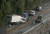 29일(현지시간) 일본 가나가와 현 오다와라시의 한 해안도로에서 태풍으로 인한 파도가 도로를 덥쳐 운행중이던 차량들이 충돌해 피해를 입었다. [EPA=연합뉴스]
