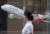 서울 종로구 신문로 금호아시아나 본사 로비에 전시된 모형 항공기 앞으로 한 시민이 걸어가고 있다. [사진 연합뉴스]