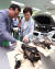 김현미 국토교통부 장관(오른쪽)이 8일 화성 교통 안전공단에서 류도정 원장으로부터 BMW 차량의 결함 부품에 대한 설명을 듣고 있다. [뉴스1]