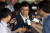 송인배 청와대 정무비서관이 12일 서울 특검 사무실에서 참고인 조사를 받고 나서며 취재진의 질문을 받고 있다. [연합뉴스]