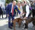 푸틴이 결혼식당에서 신랑신부의 개를 쓰다듬고 있다.[AP=연합뉴스]