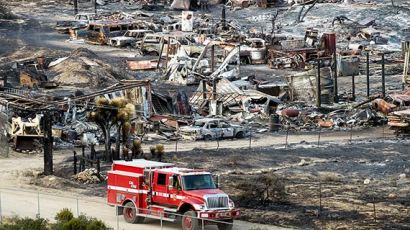 [사진] 산불·홍수로 폐허가 된 미 서부·남부