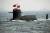 2009년 중국 해군 창설 60주년 기념 열병식에 등장한 전략 핵 미사일을 탑재한 중국 핵 잠수함 창정 6호.  [ 칭다오 AP = 연합 ]
