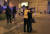 22일 밤 폭탄 테러가 발생한 영국 맨체스터 아레나 앞에서 경찰이 놀란 시민을 부둥켜 안고 있다. [AP=연합뉴스]