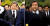 지난 2013년 5월 23일 당시 새누리당 대표였던 김무성 바른정당 의원이 추도식이 끝나고 퇴장하던 중 참석자들로부터 날아든 물병에서 나온 물을 맞고 있다. [연합]