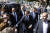 프랑스 총선을 하루 앞둔 10일 에마뉘엘 마크롱 대통령이 북부 해안도시 르 투케를 방문해 지지자들과 악수하고 있다. [AP=연합뉴스]
