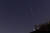 충남 계룡시 계룡대 비상활주로 주변으로 페르세우스자리 유성우(流星雨)가 불빛과 함께 떨어지고 있다. &#39;성 로렌스의 눈물&#39;이라고도 불리는 페르세우스 유성우는 매년 8월 스위프트-터틀 혜성이 우주공간에 남긴 먼지 부스러기가 지구 대기권과 충돌해 불타면서 별똥별이 비처럼 내리는 현상이다. [프리랜서 김성태]