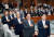 박주선 비상대책위원장(왼쪽) 등 국민의당 의원들이 11일 오후 국회 본청에서 열린 의원총회에 참석해 국기에 대한 경례를 하고 있다. [연합뉴스]