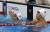 박태환 선수가 6일 오후(현지시간) 브라질 리우데자네이루 바하 올림픽 수영장에서 남자 400미터 자유형 예선을 마치고 기록을 확인하고 있다. 오른쪽은 쑨양. [올림픽사진공동취재단]
