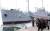 평양시민들이 대동강반에 전시돼 있는 미국 해군 정찰함 푸에블로호를 참관하고 있다. 이 함선은 1968년 1월 23일에 조선인민군 해군에 의해 나포된지 49년이 된다. [ 연합뉴스 ]