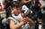5살짜리 &#39;아이보&#39; 견주가 26일 일본 도쿄에서 열린 팬 미팅에 참석해 자신의 아이보를 안아주고 있다. [EPA=연합뉴스]